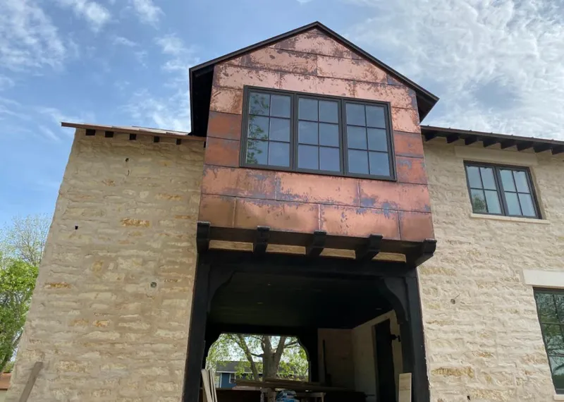 Copper metal panel facade on a stone building for Metal Roof Coating in Parkland